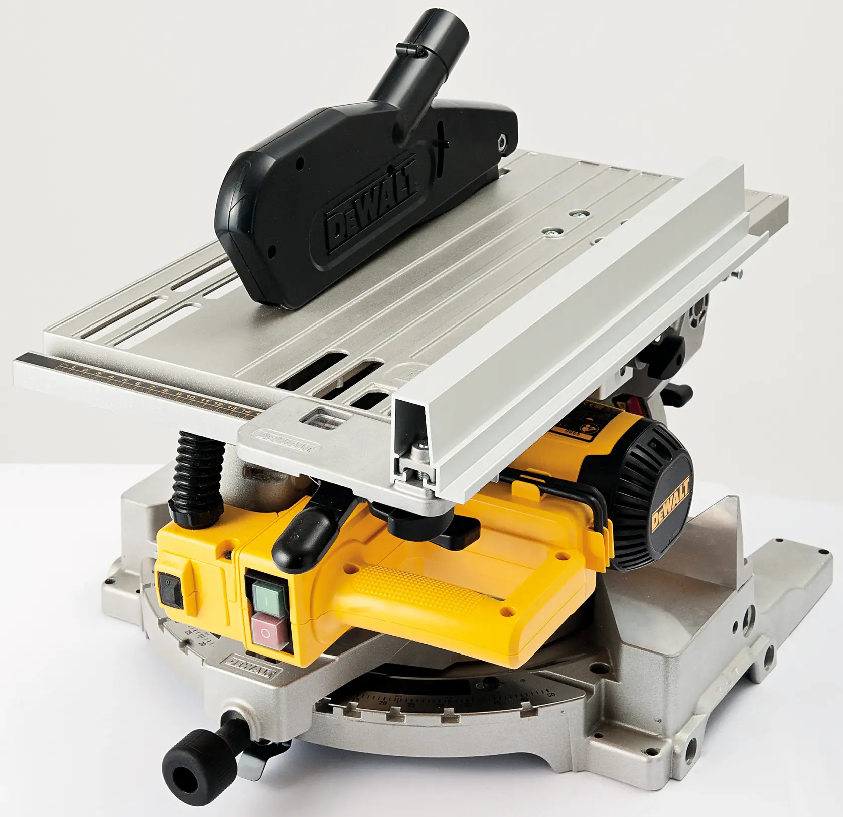 A DEWALT power saw with a yellow base, aluminum table, and black dust extraction attachment, designed for precision cutting tasks.