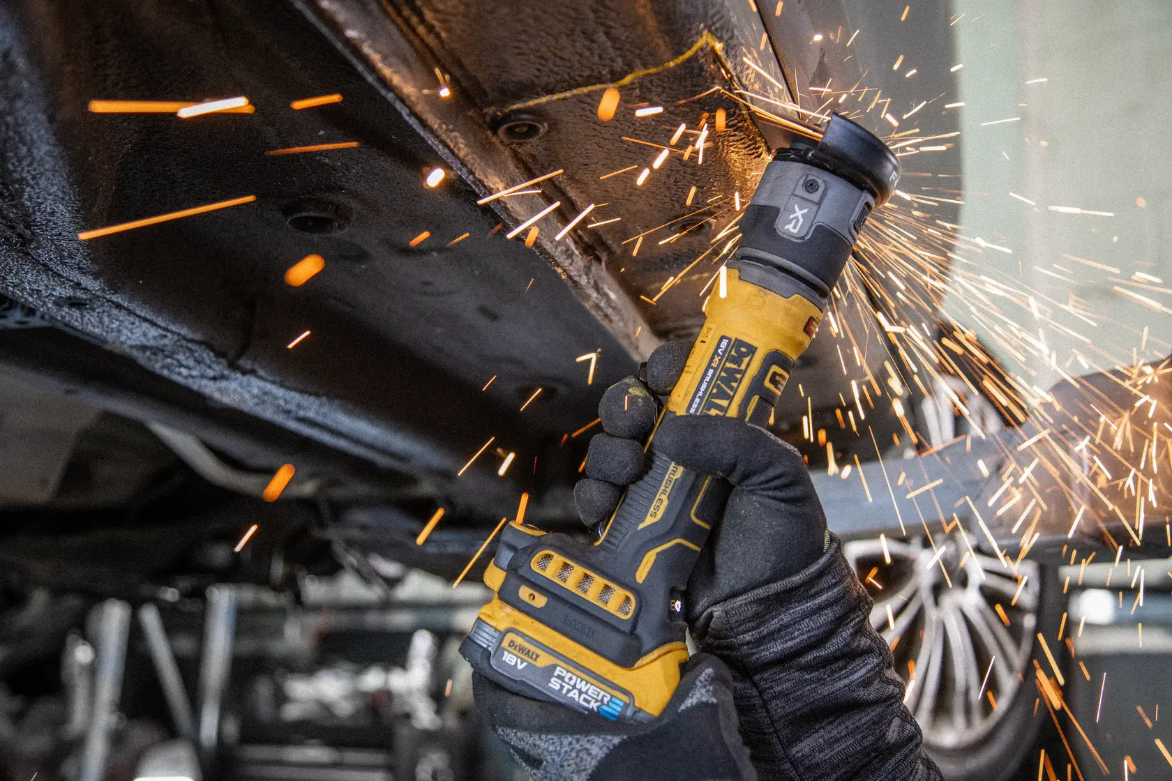 DEWALT DCG430N-XJ, DCG430N grinder cutting metal with sparks. Photography product category.